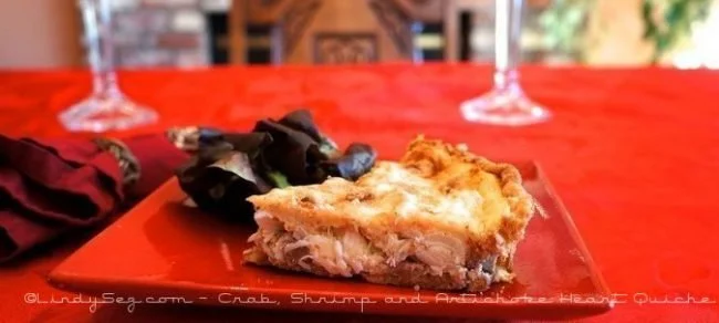 Crab shrimp artichoke heart quiche served on a rustic wooden table