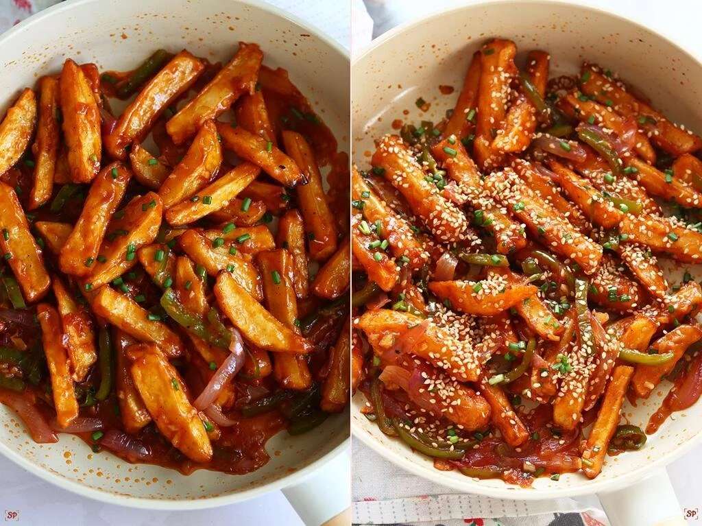 Delicious plate of honey chilli potato garnished with green onions