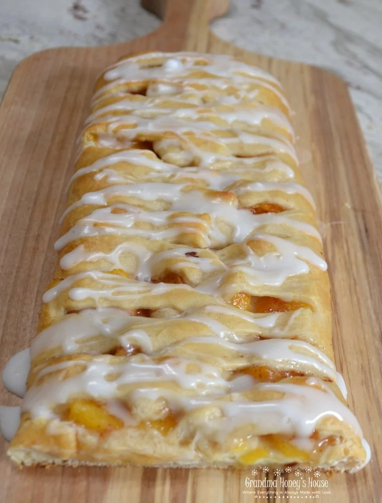Peaches and Cream Crescent Braid pastry with peach filling on a platter