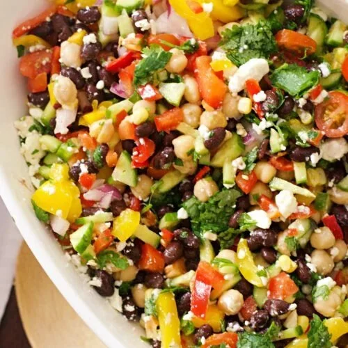 Bowl of simple Southwest corn salsa with vibrant vegetables and herbs