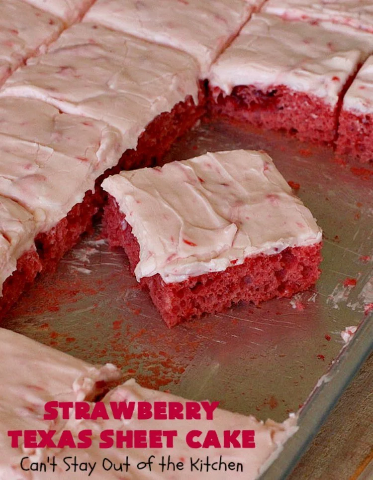 Delicious Texas Strawberry Sheet Cake topped with fresh strawberries and cream