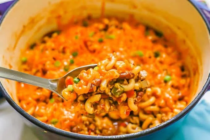 Turkey Chili Pasta Skillet in a cast-iron pan garnished with fresh herbs